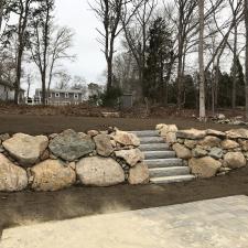 Natural Rock Retaining Wall Installation in Falmouth, MA